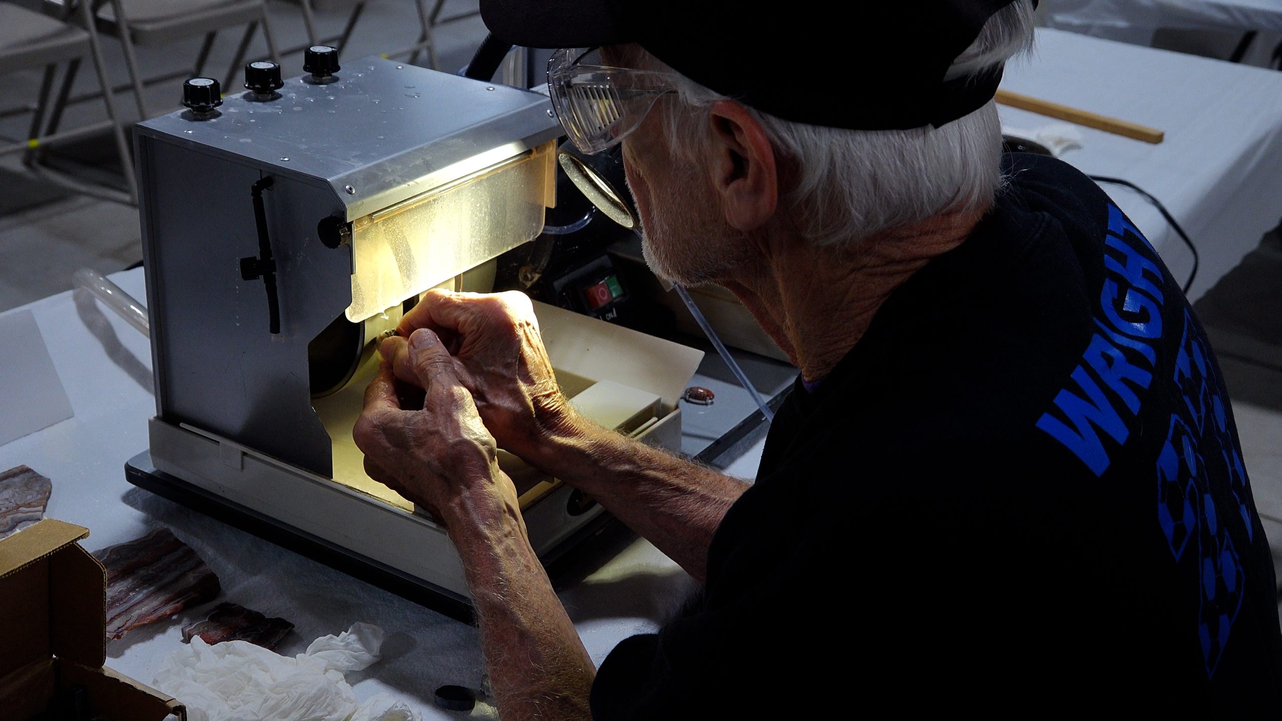 Experts Working Their Crafts Toledo Gem & Rockhound Club member, Henry, cabbing at Treasures Unearthed 2025.
